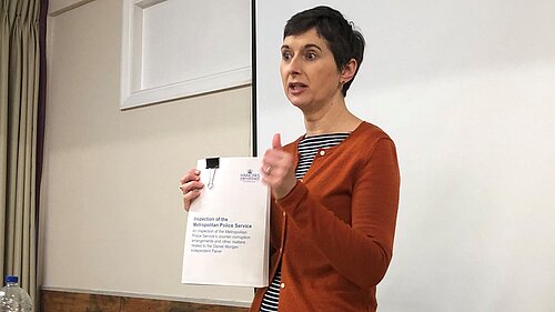 Caroline Pidgeon holing a report on the investigation of the Metropolitan Police Service